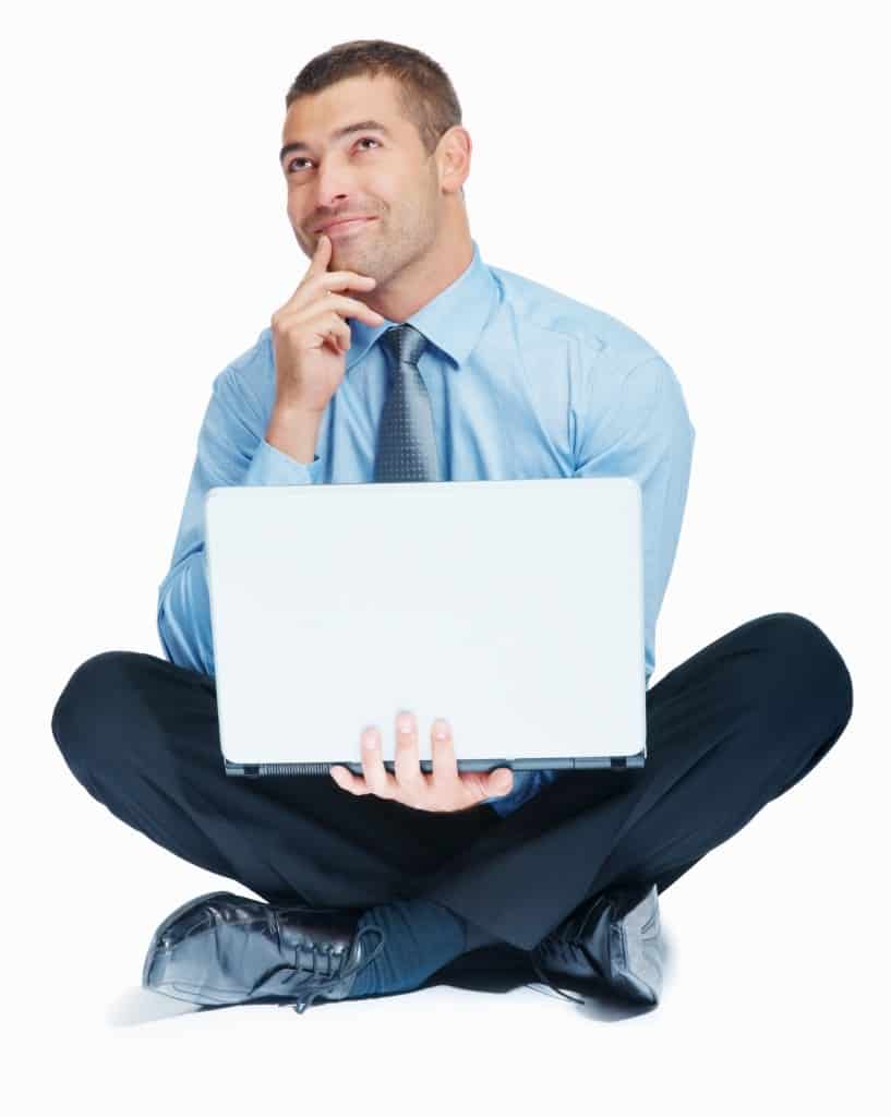 Thoughtful business man with hand on chin and laptop looking up